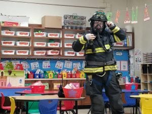 The firefighters demonstrated wat they would sound like and look like if they were coming to rescue someone from a burning building. We learned we do not need to ever be afraid of the firefighters!
