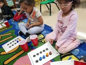 We practiced showing the quantity of items up to 6 and conservation of these quantities using a 10 dot work mat!