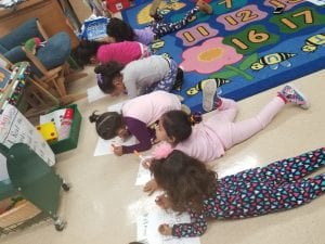 The children are learning the joy of writing and expressing their ideas on paper!