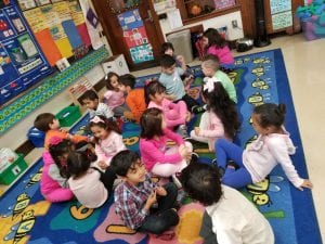 We made a prediction during the story "The Little Old Lady Who Was Not Afraid of Anything" by Linda Williams. We turned to our buddies and shared our predictions about what the little old lady would see when she opened the door.