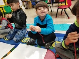 We made bracelets with 10 beads to show different number pairs that make 10.