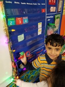 We went on a 3D shape hunt around the room. This friend found a cone shaped item....our light bulb on our Christmas lights.