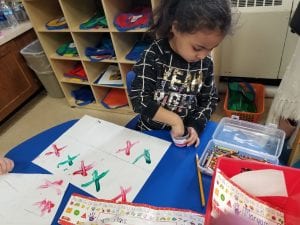 We finger painted the letter X as we practiced saying its sound.