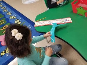 We sewed with yarn on the letter Y!