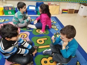 We worked with our carpet buddies on noticing how our faces change when we are smiling and happy. We help up a mirror for our buddy to notice how when they smile; their eyes open big, their cheeks raise up, and their smile forms on their face.