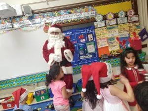 Santa brought his jingle bells and played them while we sang!