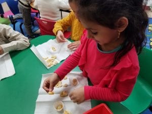 We created edible beehives using cereal and honey! After being busy bees, we got eat our hives!
