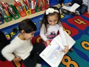 Mrs. Rawson's class visited to read us their informational books about penguins! Here is a former Young 5 student reading to a current Young 5 student! How awesome!
