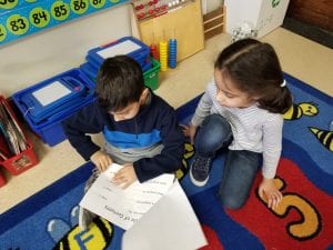 Mrs. Rawson's class visited to read us their informational books about penguins! Here is a former Young 5 student reading to a current Young 5 student! How awesome!