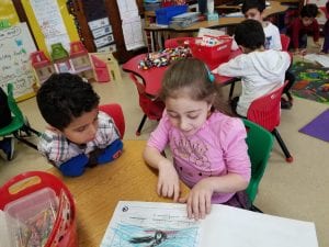 Mrs. Rawson's class visited to read us their informational books about penguins! Here is a former Young 5 student reading to a current Young 5 student! How awesome!