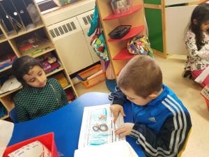 Mrs. Rawson's class visited to read us their informational books about penguins! Here is a former Young 5 student reading to a current Young 5 student! How awesome!