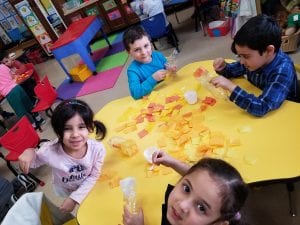 We are studying goldfish! Our door for March is Reading Month is decorated with goldfish we made from tissue paper and recycled water bottles!