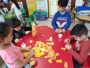 We are studying goldfish! Our door for March is Reading Month is decorated with goldfish we made from tissue paper and recycled water bottles!
