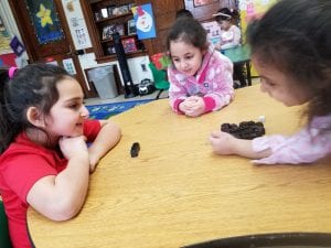 We practiced showing one less than the quantity our partner rolled with the dice using the sentence stem, "One less than ___ is ____." I encourage you to try this at home with your child using dice and 6 objects.