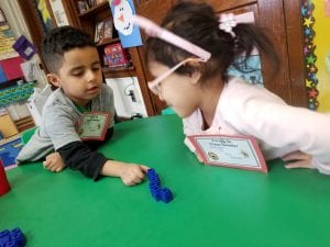 We practiced showing one less than the quantity our partner rolled with the dice using the sentence stem, "One less than ___ is ____." I encourage you to try this at home with your child using dice and 6 objects.