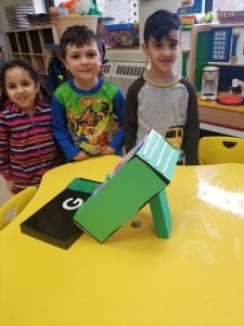 We worked in teams to construct leprechaun traps!