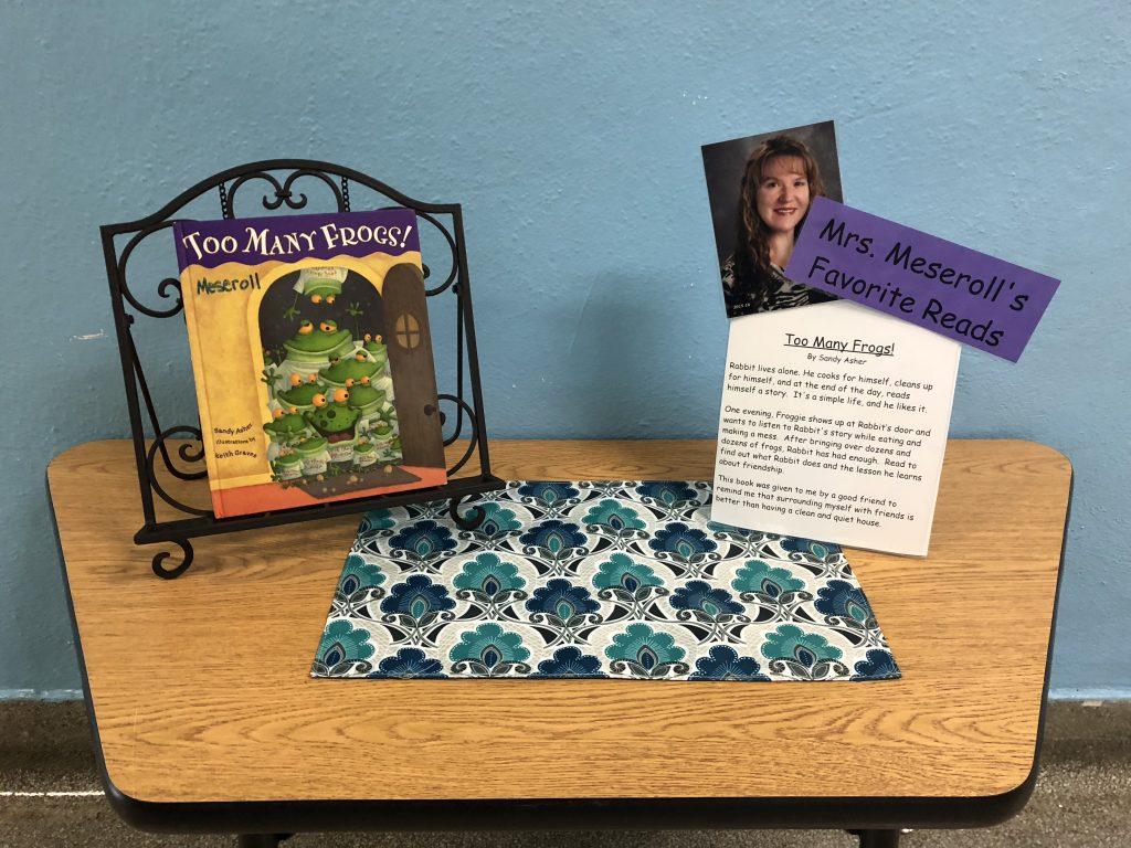 book display with a favorite book and description of why it is a favorite
