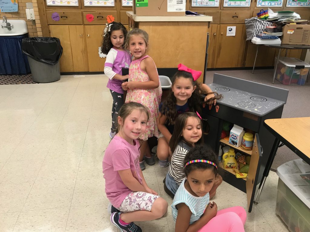 Six students working together in the housekeeping area