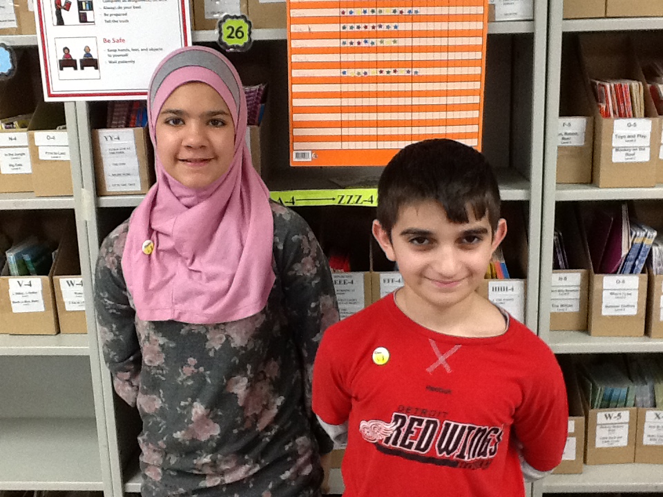 Noor and Mohammed pose with their Cadet Music Pins