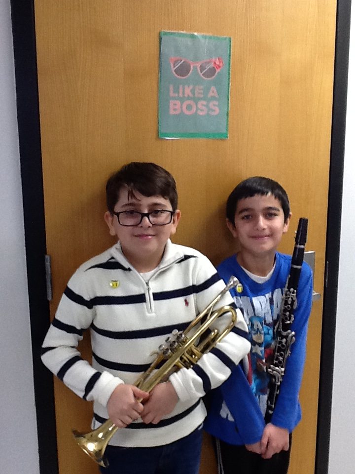 Two boys wearing Cadet Music Pins.