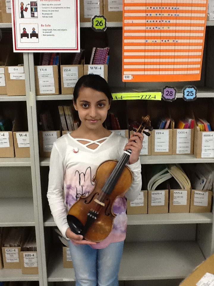 Thuraya has earned her intermediate music pin.