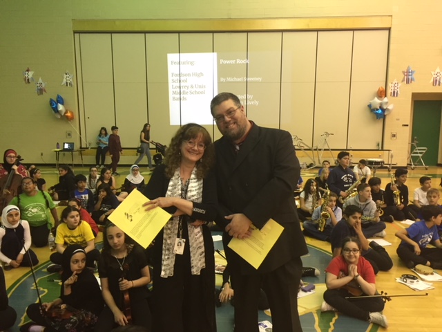 Mr. Taylor and Mrs. Reed pose for a photo