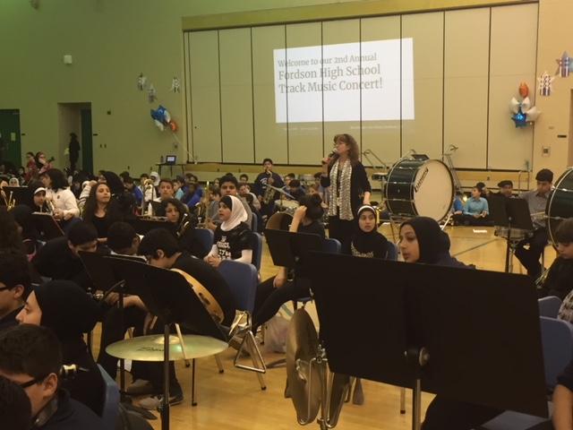 Mrs. Reed acts as MC for the concert.