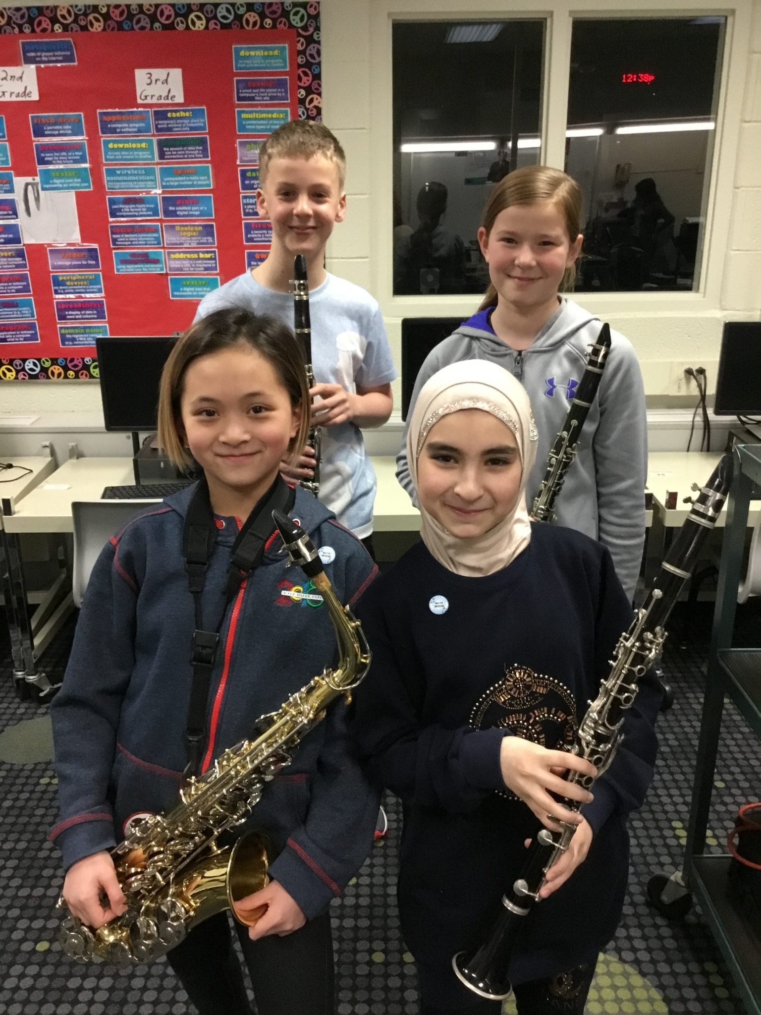 Four students who have earned their Master Pin. They have said they want to create a 5th pin and create their own song list. :D