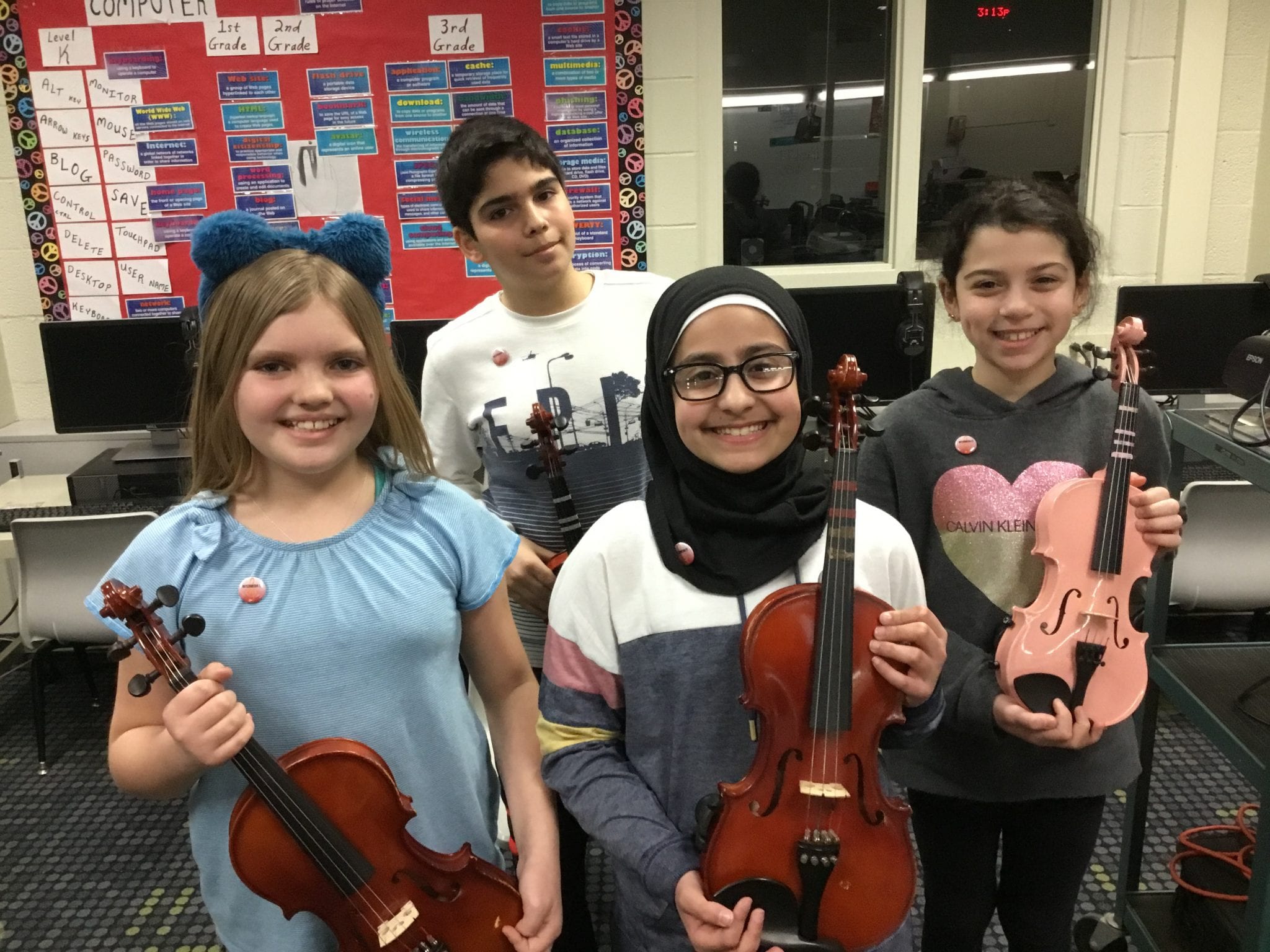 these four violinists have earned their Intermediate Pin and have already begun work on the First Class Pin songs.