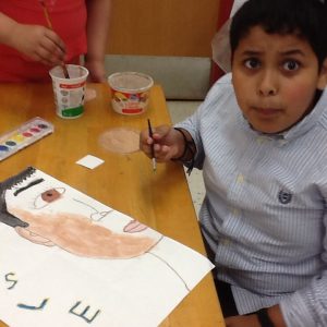 Students are painting the faces.