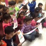students are reading their 2D shapes book
