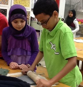 Students making a clay bowls