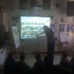 The guest speaker, Dan Gumina showing a video about tumbling and polishing stones