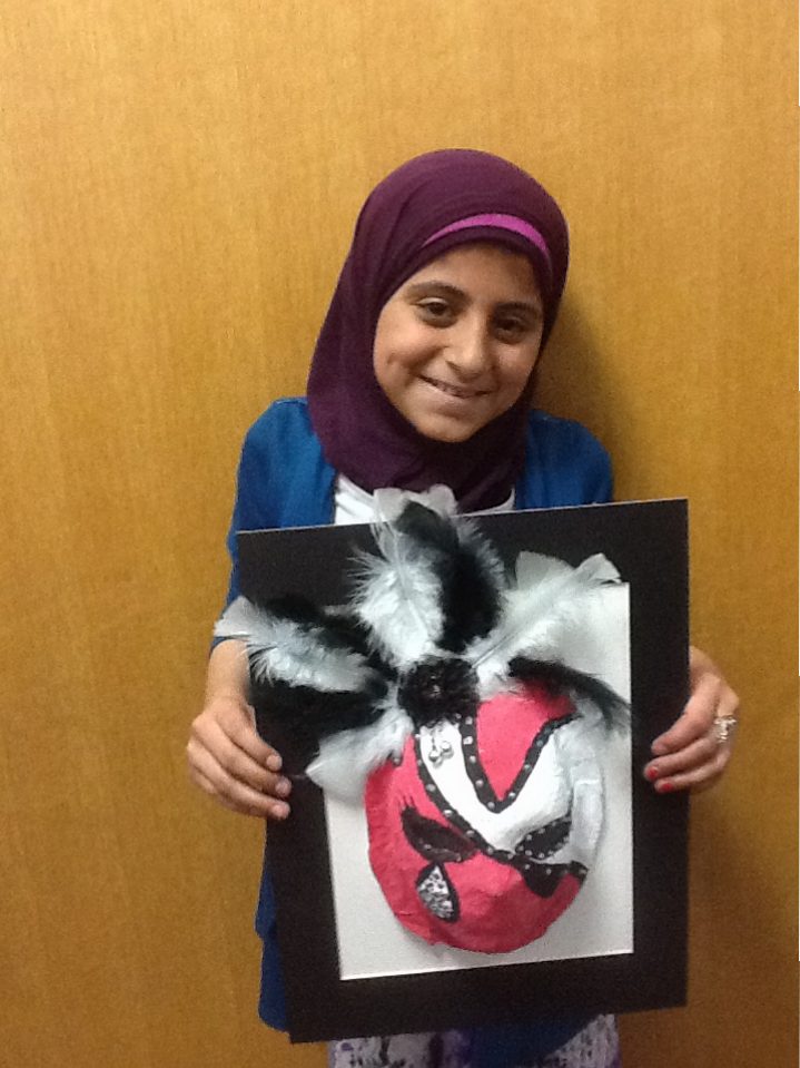 Heyam holding her mask