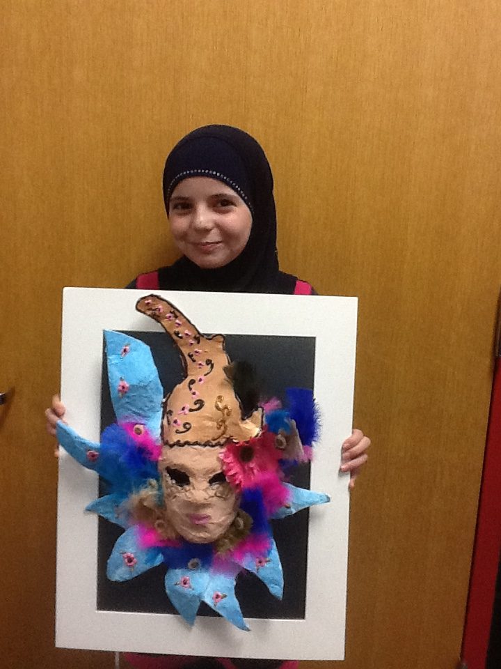 Walaa holding her mask