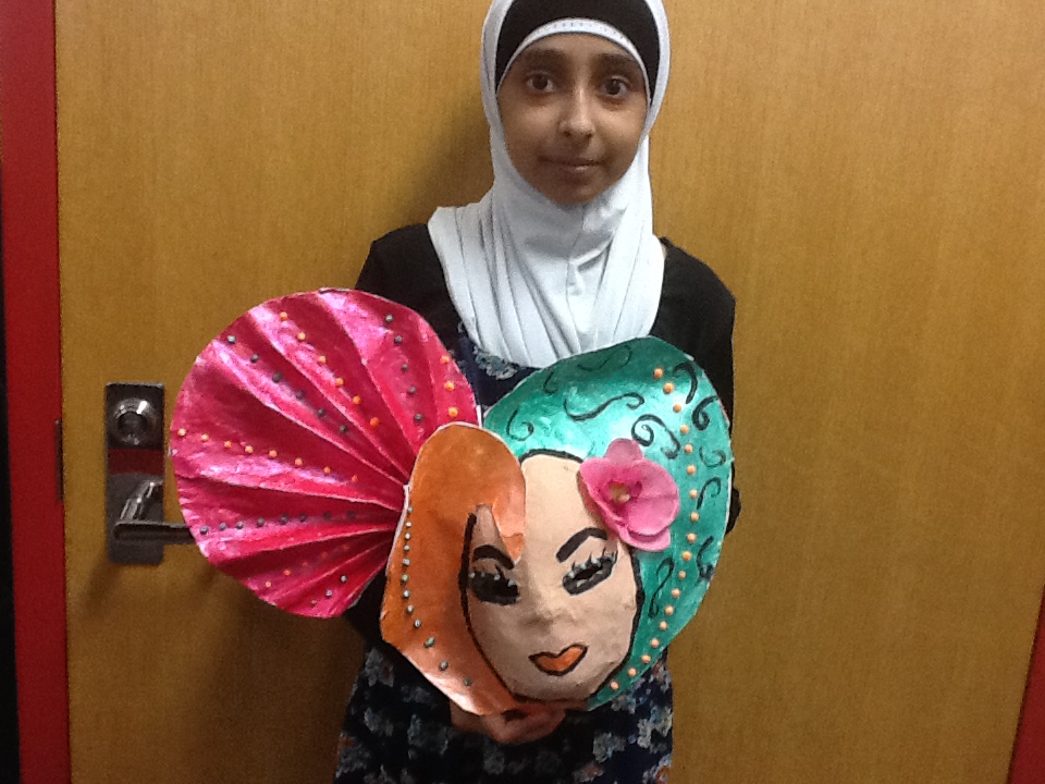 Mana holding her mask