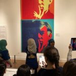 Students Looking at the self -portrait of Andy Worhal