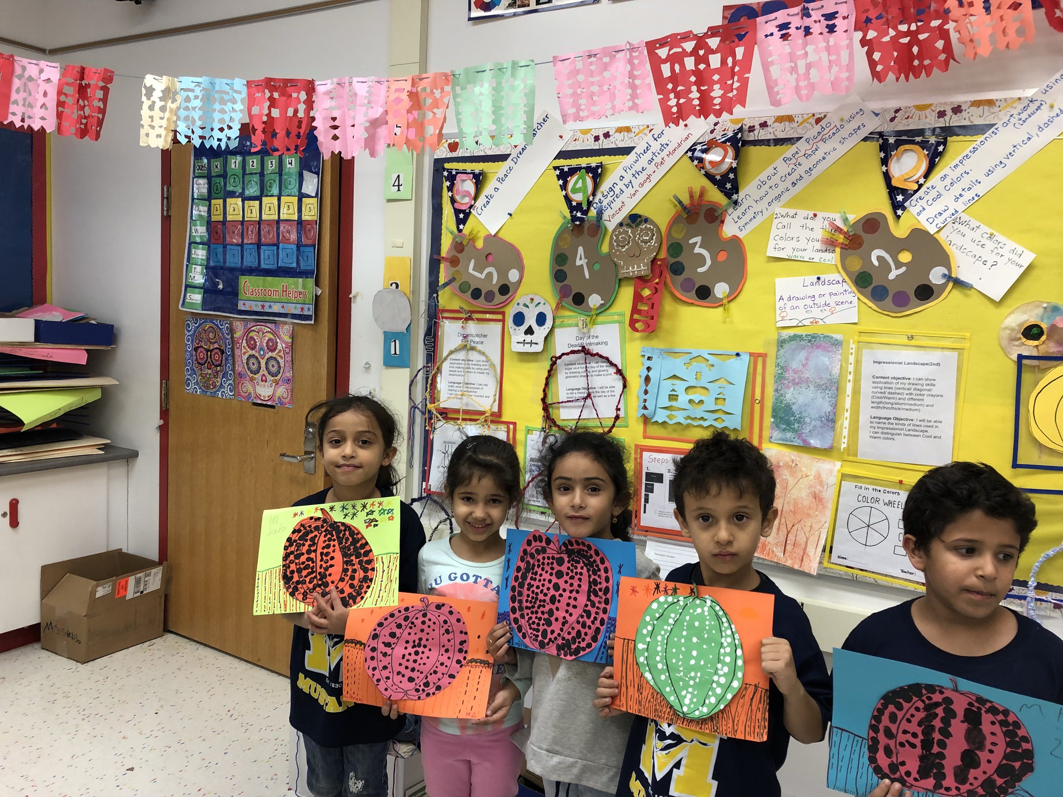 First graders are showing their warm and cool color pumpkin artwork