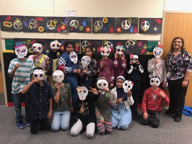 Students wearing their Day of the Dead Mask
