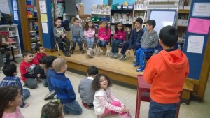 Mayor Nora is listening to citizen Karim  tell the City Council his neighborhood problem. 
